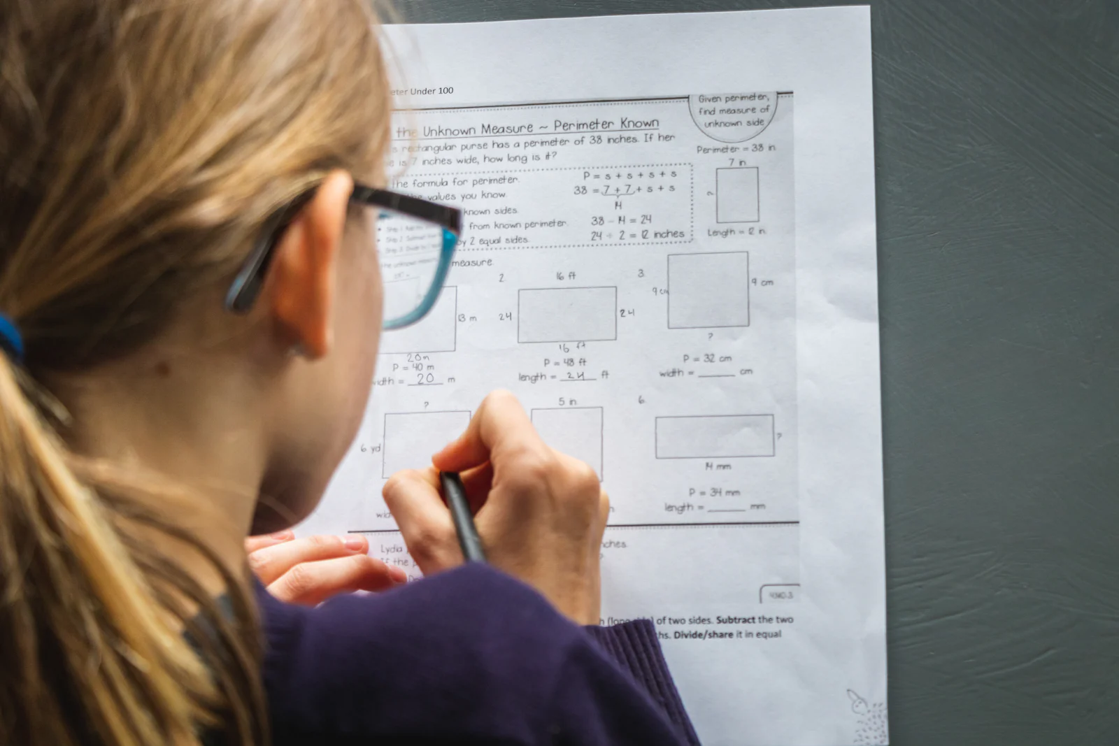 A pupil working through a perimeter worksheet